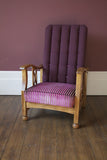 Edwardian Style Reciliner; oak frame and a upholstered fluted back. Covered in a smart Linwood plum velvet.